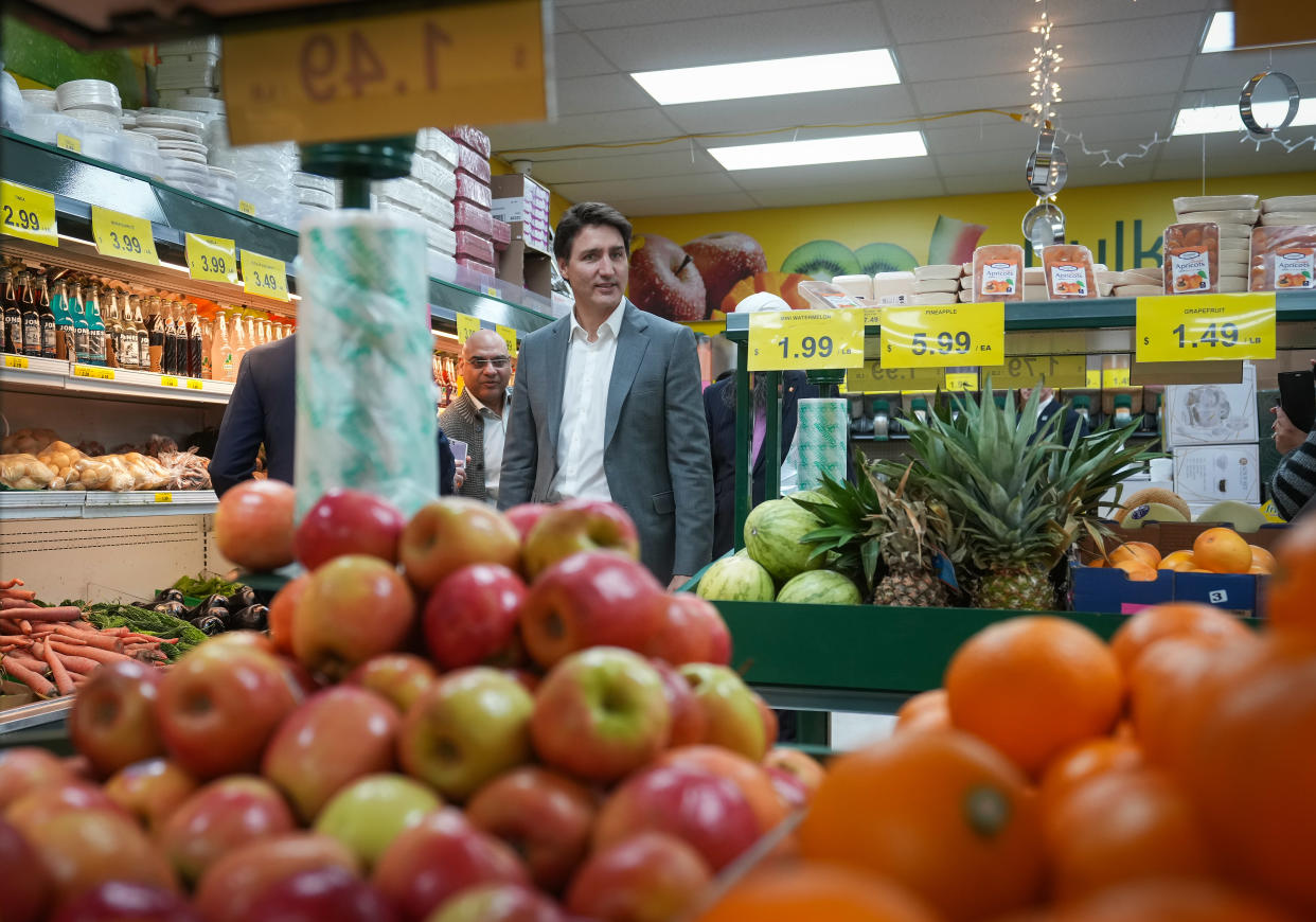 Prime Minister Justin Trudeau walks through the produce area during a visit to a Fruiticana grocery store in Surrey, B.C., on Tuesday, November 14, 2023. THE CANADIAN PRESS/Darryl Dyck