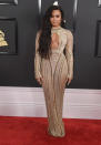 <p>For the 59th Grammy Awards, Demi Lovato donned a backless dress from Julien MacDonald’s spring 2017 ready to wear collection.<br><br>The singer accessorised with co-ordinating heels by Giuseppe Zanotti and an Edie Parker clutch. <em>[Photo: Getty]</em> </p>