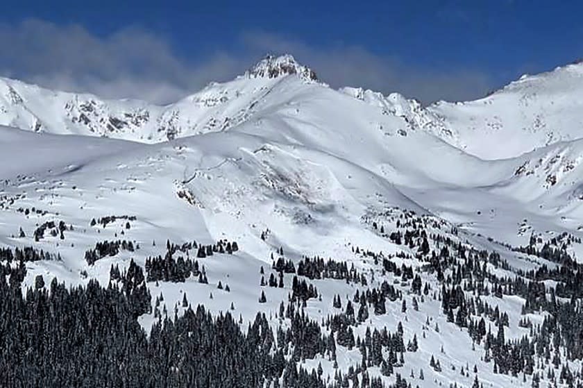 This image provided by Colorado Avalanche Information Center shows an avalanche that killed an unidentified snowboarder on Sunday, Feb. 14, 2021, near the town of Winter Park in Colorado. The deaths of two Colorado men caught in avalanches and a third in Montana over the frigid Presidents Day weekend underscore the danger of backcountry conditions in the Rocky Mountains, where skiers and snowboarders risk triggering exceptionally weak layers of snow that are the most hazardous conditions in a decade (Colorado Avalanche Information Center via AP)