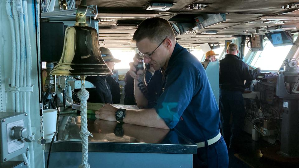 Capt. Douglas Graber introduces MA3 Malia Jones, who is selected as the USS Nimitz's Sailors of the Day, via the Navy's public address system,1 MC Announcement, on the ship's way back to Bremerton on July 1, 2023.