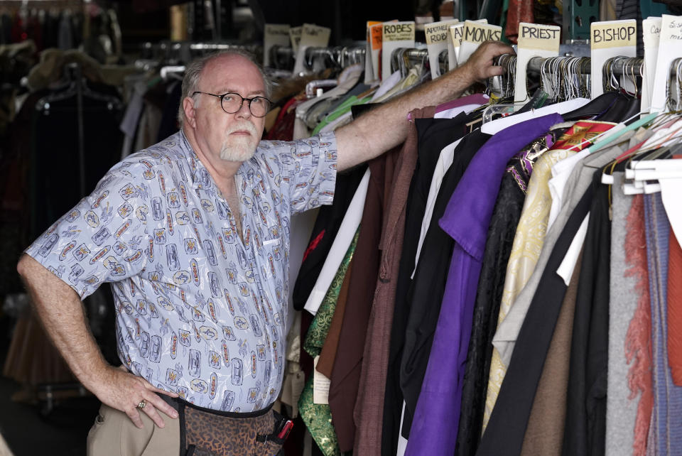 Shon LeBlanc, co-owner of costume rental service Valentino's Costume Group, poses for a portrait amongst racks of themed clothing at his store, Friday, May 26, 2023, in Los Angeles. (AP Photo/Chris Pizzello)