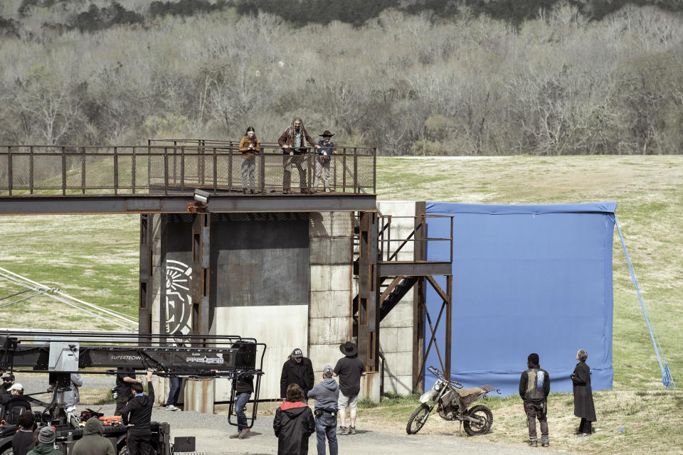 This image released by AMC shows the cast and crew on location in Georgia during the filming of season 11 of "The Walking Dead." (Jace Downs/AMC via AP)