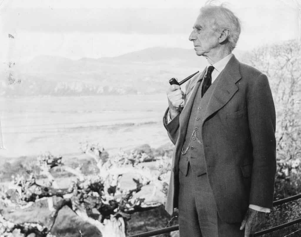 Russell smoking his pipe as he looks out to sea, circa 1960 (Getty)