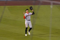 San Francisco Giants left fielder Hunter Pence can't find a fly ball hit by Los Angeles Dodgers' Enrique Hernández for a triple during the sixth inning of a baseball game Saturday, Aug. 8, 2020, in Los Angeles. (AP Photo/Mark J. Terrill)