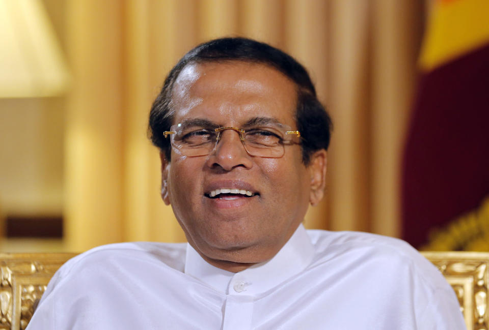 FILE - In this May 7, 2019, file photo, Sri Lankan President Maithripala Sirisena smiles during an interview with the Associated Press at his residence in Colombo, Sri Lanka. Sirisena has opted not to seek a second term, as officials began accepting nominations Monday for next month’s election. (AP Photo/Eranga Jayawardena, File)