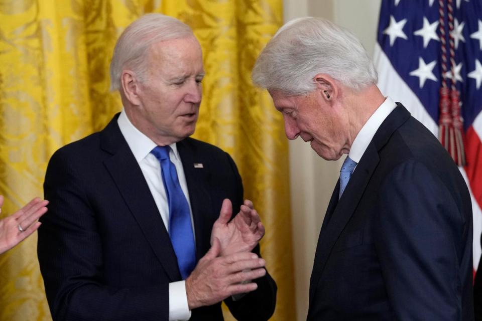 President Joe Biden talks with former President Bill Clinton during an event in the East Room of the White House in Washington, Thursday, Feb. 2, 2023, to mark the 30thÂ Anniversary of the Family and Medical Leave Act. (AP Photo/Susan Walsh) (AP)