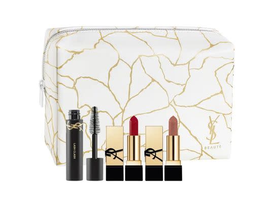 A Yves Saint Laurent travel set with a pouch