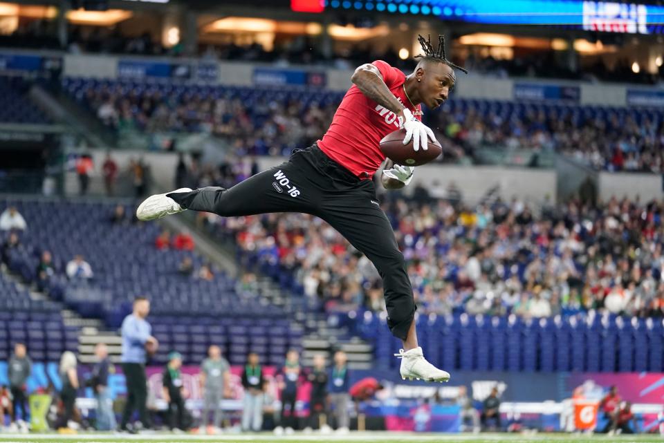 Boston College wide receiver Zay Flowers runs a drill at the NFL football scouting combine in Indianapolis, Saturday, March 4, 2023. (AP Photo/Michael Conroy)