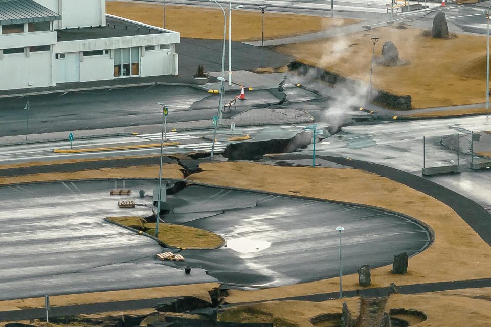 This image taken with a drone shows cracks next to a children playground in the town of Grindavik, Iceland (AP)