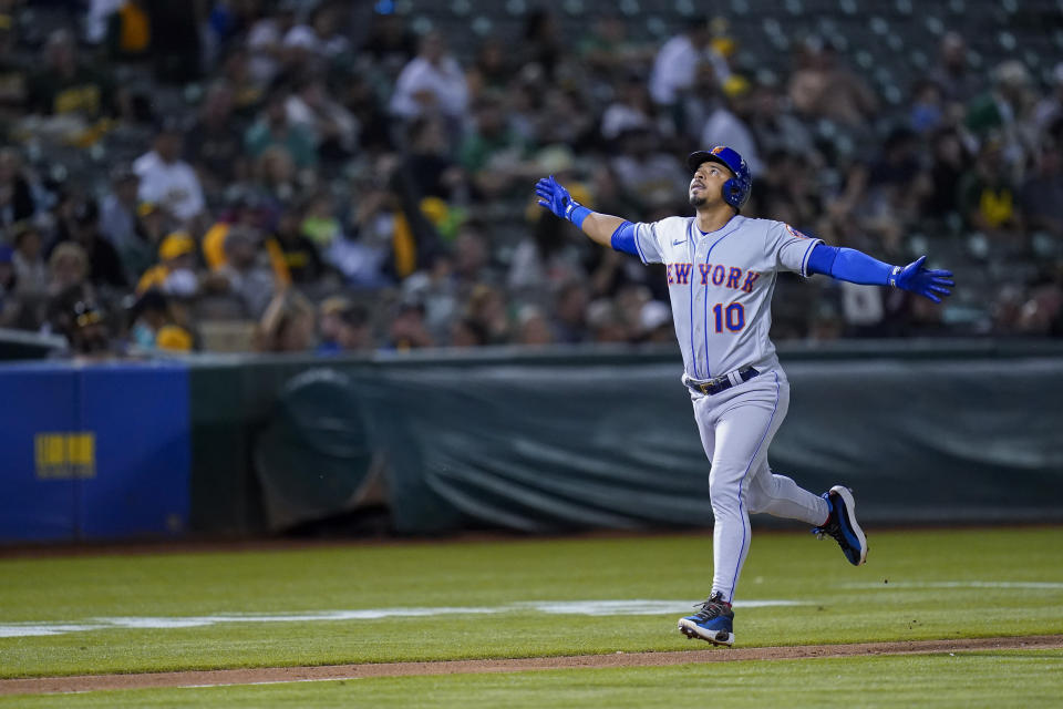 New York Mets' Eduardo Escobar runs the bases after hitting a grand slam against the Oakland Athletics during the fifth inning of a baseball game in Oakland, Calif., Friday, Sept. 23, 2022. (AP Photo/Godofredo A. Vásquez)
