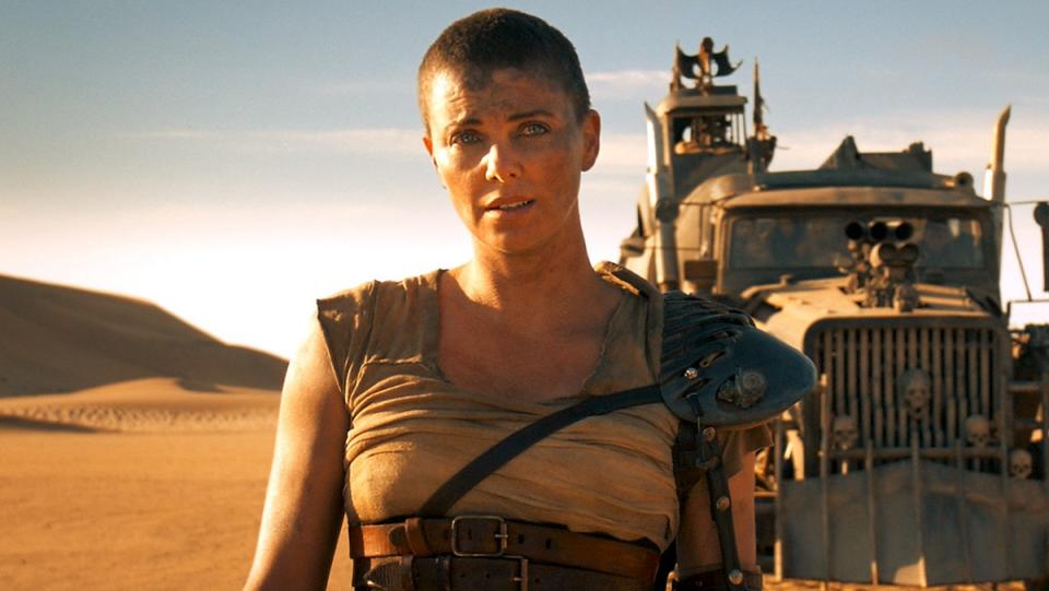 Furiosa stands before the War Rig in Mad Max: Fury Road