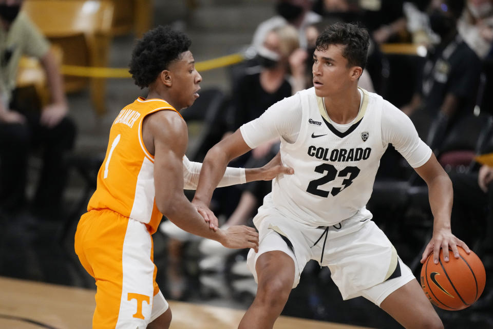 Colorado forward Tristan da Silva, right, looks to pass the ball as Tennessee guard Kennedy Chandler defends in the first half of an NCAA college basketball game Saturday, Dec. 4, 2021, in Boulder, Colo. (AP Photo/David Zalubowski)