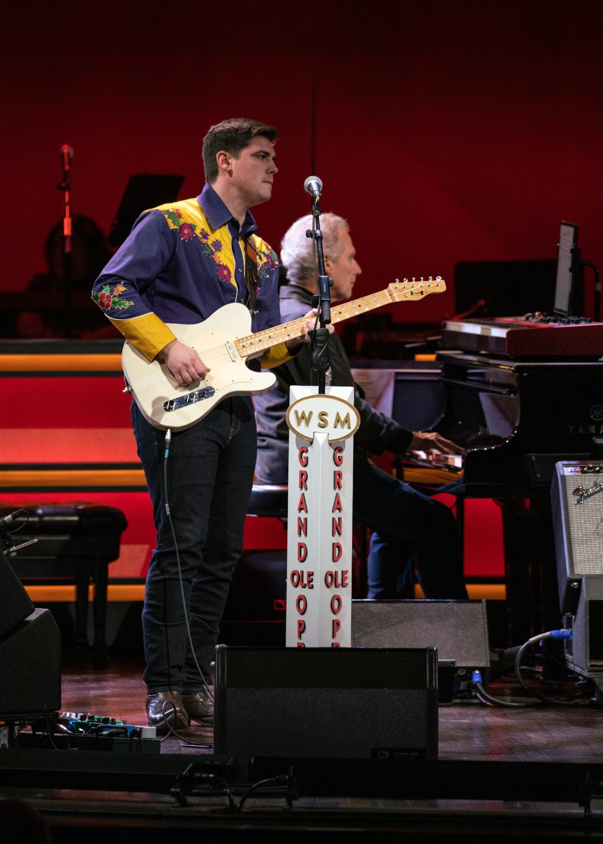 Brian Poston, guitarist for honky-tonk and classic country band The Shootouts, performs at the Grand Ole Opry in February.