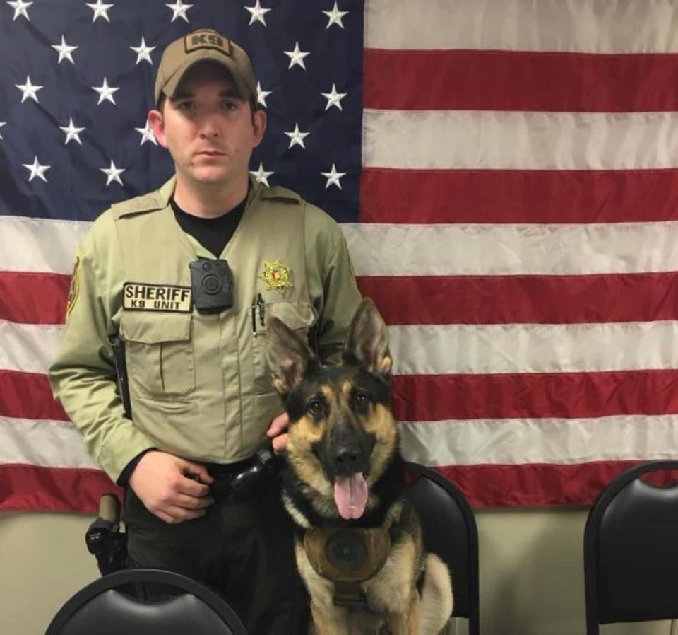 Bibb County Sheriff’s Deputy Brad Johnson is seen with his canine partner Bodie in this undated photo from the Bibb County Sheriff’s Department Facebook page. 