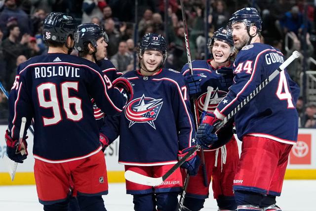 Feb 16, 2023; Columbus, Ohio, USA;  Columbus Blue Jackets teammates celebrate a goal by center Kent Johnson (91) during the third period of the NHL hockey game against the Winnipeg Jets at Nationwide Arena. The Blue Jackets won 3-1. Mandatory Credit: Adam Cairns-The Columbus Dispatch