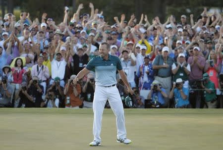 Sergio Garcia of Spain celebrates winning the Masters with a putt on the 18th green during a playoff against Justin Rose of England in the final round of the 2017 Masters golf tournament at Augusta National Golf Club in Augusta, Georgia, U.S., April 9, 2017. REUTERS/Lucy Nicholson