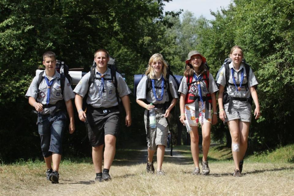 ALMKE, GERMANY - AUGUST 01:  Scouts hiking through a woodland on August 1, 2010 in Almke near Wolfsburg, Germany. About 5000 young scouts from Germany, Russia, Belgium, Suisse, USA and Italy aged 12 to 20 participate in a camp. Since 1973, the German VCP-Christian Guides and Pathfinders organisation, offers an International historic boys and girls scout meeting during the summer holidays. On a 25 hectare field include 1370 tens, a tent church and a tent theater. The Federal camp is held every four years.  (Photo by Andreas Rentz/Getty Images)