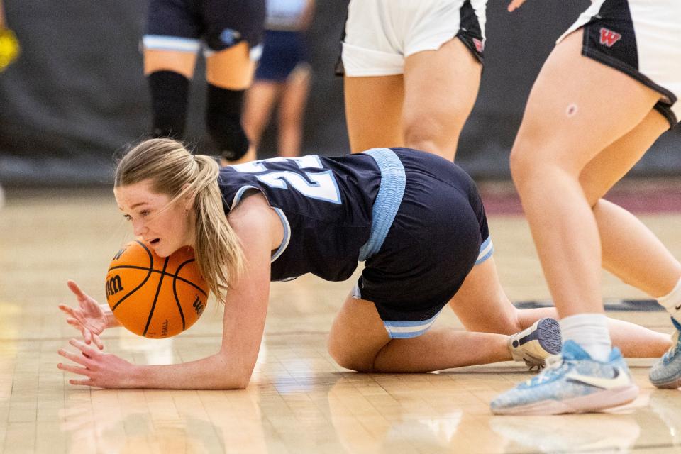 Salem Hills Skyhawks’ Brooke Warren (23) falls on the ball during a game against the West Panthers at West High School in Salt Lake City on Thursday, Feb. 22, 2024. | Marielle Scott, Deseret News