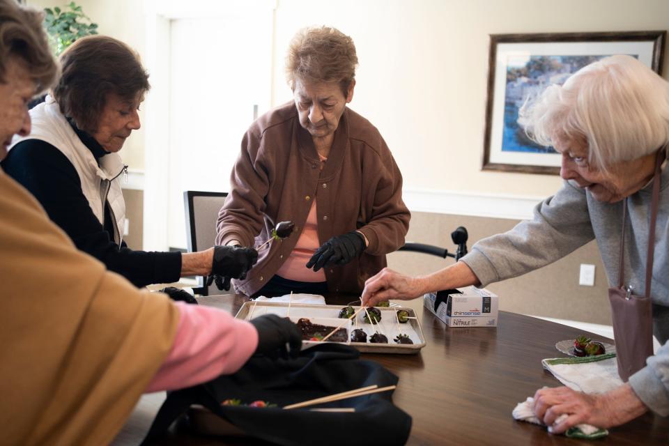 Residents at StoryPoint Gahanna make chocolate strawberries during a heart healthy cooking demonstration at the facility. The retirement community received the highest resident satisfaction rating in Franklin County on a state survey of long-term care facilities.