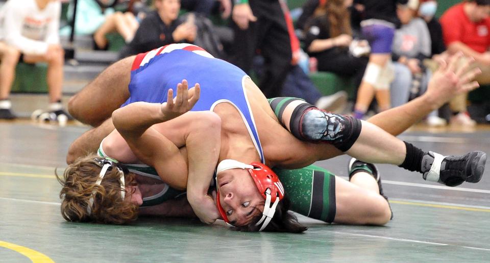 West Holmes' Dylan Strouse pins Smithville's Devan Greathouse in the title match at 138 pounds.