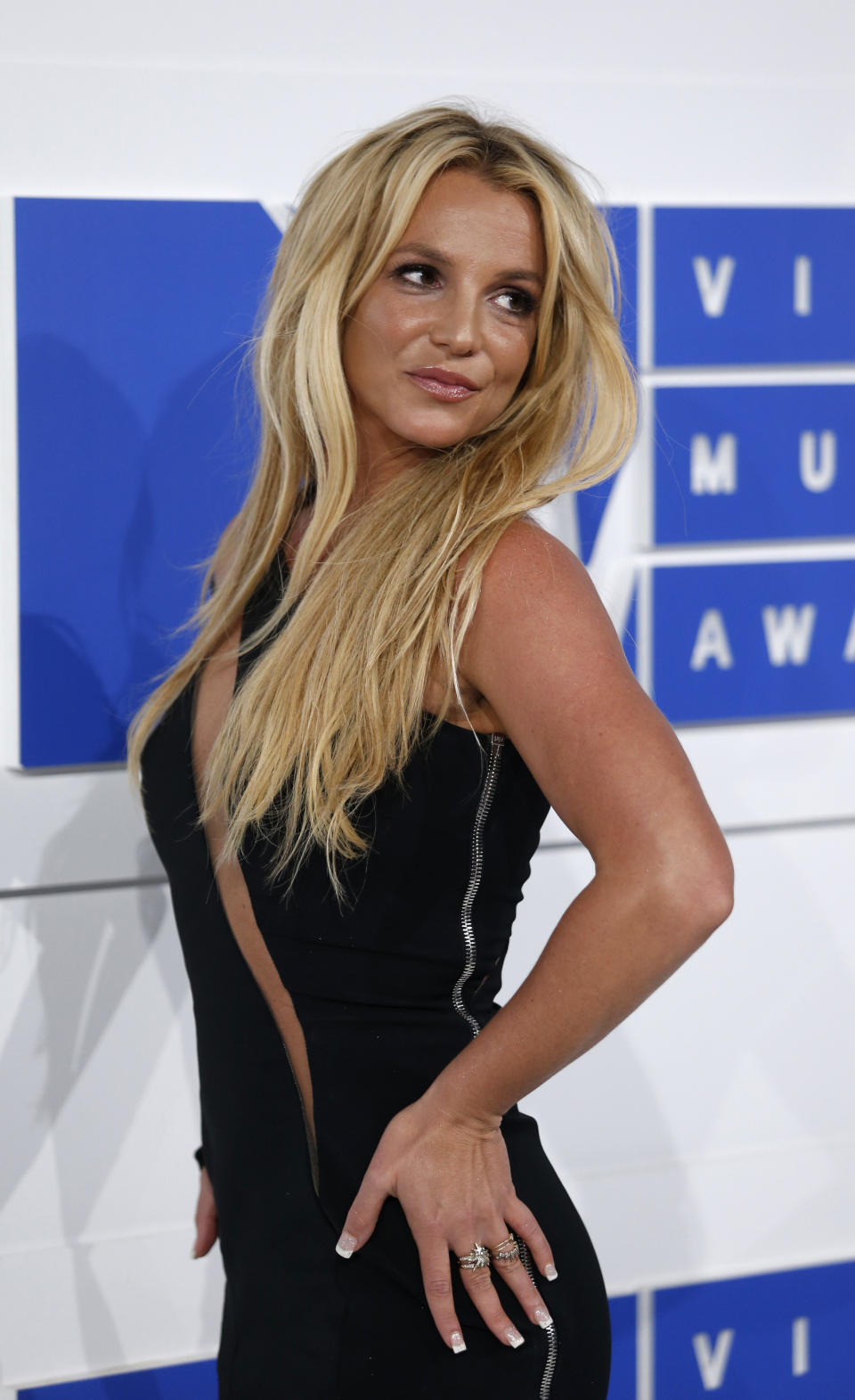 Britney Spears posing on a red carpet