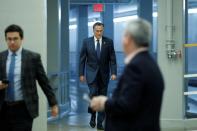 Senator Romney walks to board an elevator at the U.S. Capitol, ahead of a series of votes on response for the coronavirus disease (COVID-19), on Capitol Hill in Washington