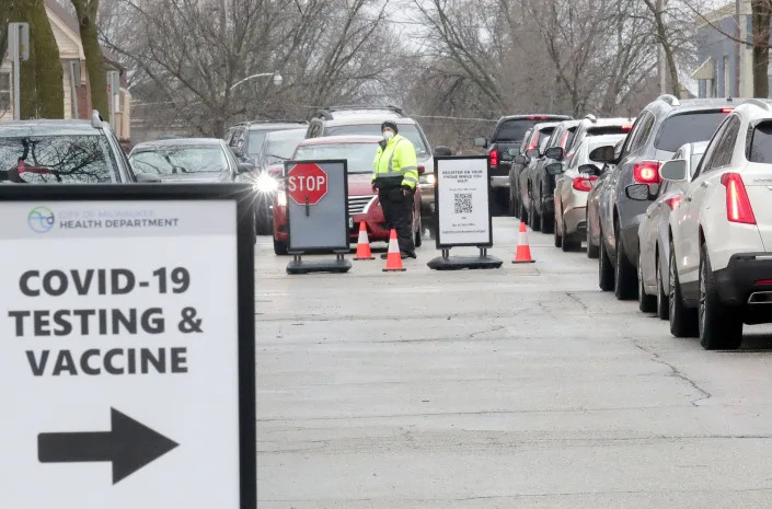 Cars line up for free COVID-19 testing at the Southside Health Center on South 23rd Street in Milwaukee on Dec. 27.