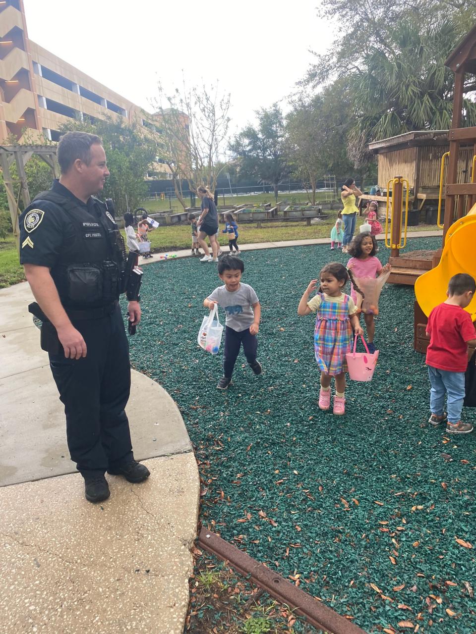 UCF police officers surprised children at the UCF Creative School with an egg hunt.