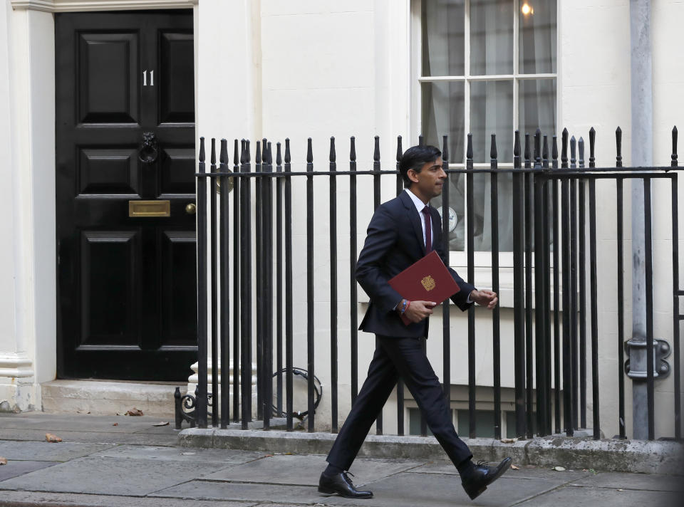 Britain's Chancellor of the Exchequer Rishi Sunak leaves No 11 Downing Street, heading for the House of Commons to unveil details of his Winter Economy Plan, in London, Thursday Sept. 24, 2020. (AP Photo/Frank Augstein)