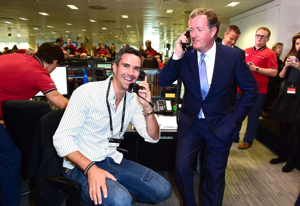 Kevin Pietersen (left) and Piers Morgan take part in the BGC Annual Global Charity Day at Canary Wharf in London.