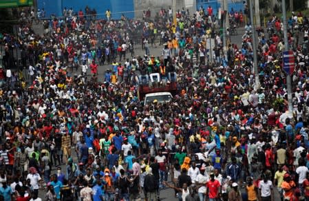 Demonstrators march during a protest to demand the resignation of Haitian president Jovenel Moise, in the streets of Port-au-Prince