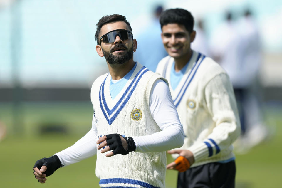 India's Virat Kohli, left, looks up during a training session at The Oval cricket ground, in London, Monday, June 5, 2023. Australia will play India in the World Test Championship 2023 Final at The Oval starting June 7. (AP Photo/Kirsty Wigglesworth)