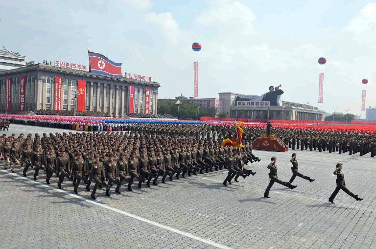 Worker-Peasant Red Guards parade through Kim Il-Sung Square in Pyongyang to mark the 65th anniversary of the national foundation day, September 9, 2013