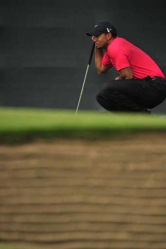 Tiger Woods of the US lines up a putt during his final round on day four of the 2012 British Open Golf Championship at Royal Lytham and St Annes in Lytham, north-west England. Ernie Els won the Open Championship and ended a 10-year major victory drought in shocking fashion on Sunday at Royal Lytham as Adam Scott squandered a four-stroke lead with four holes to play