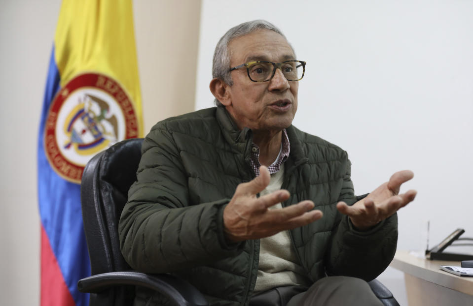 Dario Acevedo, director of the National Center for Historical Memory, speaks during an interview at his office in Bogota, Colombia, Thursday, Dec. 12, 2019. Acevedo has rejected a draft plan for the content of a planned Museum of Memory, which will pay homage to the millions of victims of the country’s long civil conflict, and has publicly questioned the number of victims of the five-decade war. (AP Photo/Fernando Vergara)