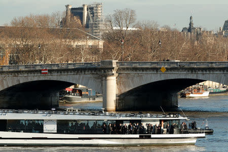 The 'Mirage' boat transporting the French President and heads of State and government is seen on the Seine river in Paris on its way to the Ile Seguin near Paris as part of the One Planet Summit, France, December 12, 2017. REUTERS/Yoan Valat/Pool