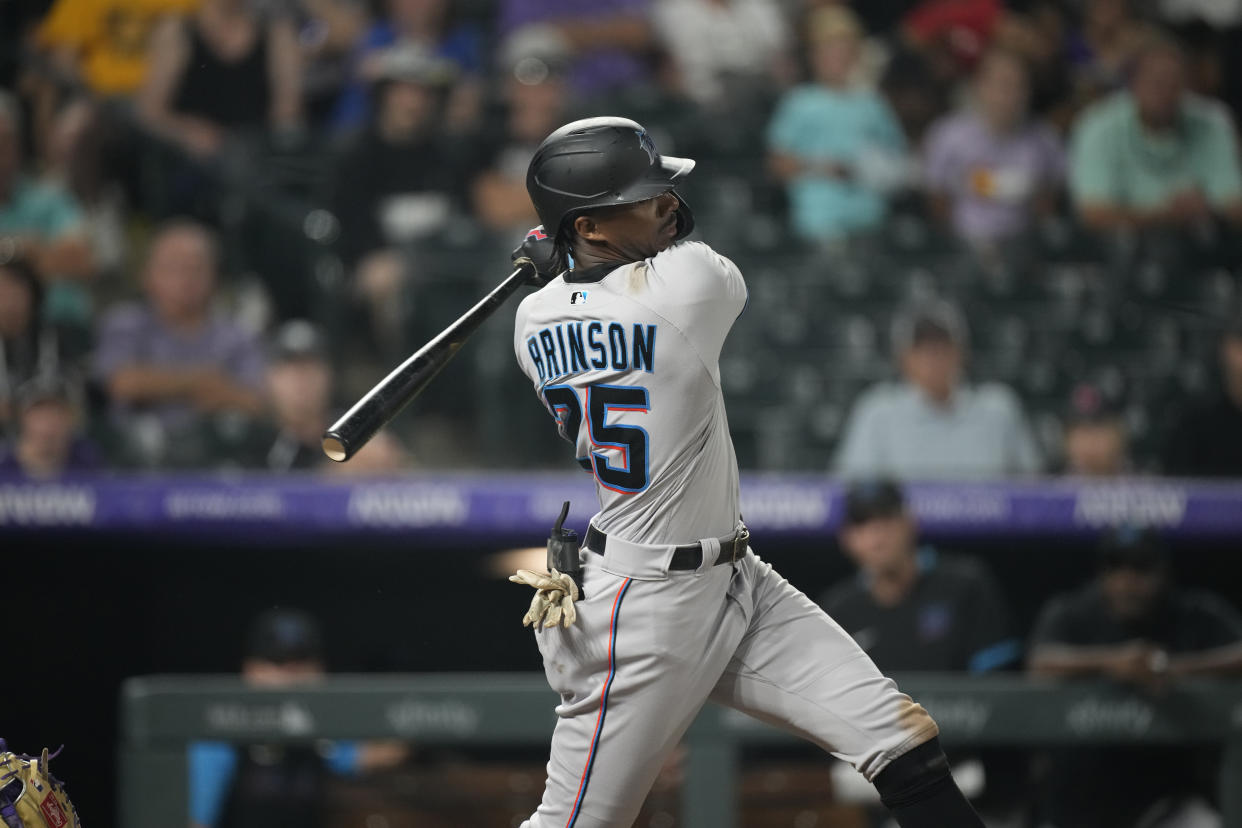 Miami Marlins right fielder Lewis Brinson (25) in the eighth inning of a baseball game Saturday, Aug. 7, 2021, in Denver. (AP Photo/David Zalubowski)