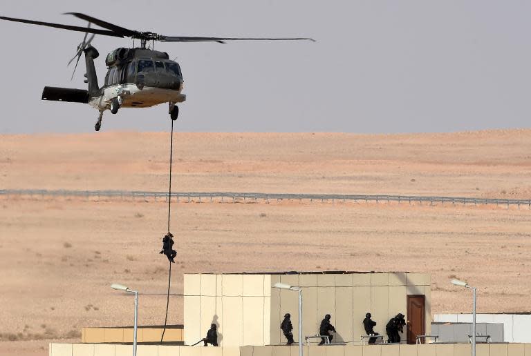 Members of Saudi special forces take part in "anti-terrorist" exercises on March 18, 2015 in the desert scrubland of Suwayf, north of Arar city on the Iraqi border, where three troopers died in a January attack blamed on "terrorists"