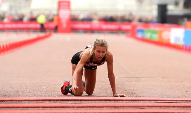 Hayley Carruthers on the ground as she crosses the line 