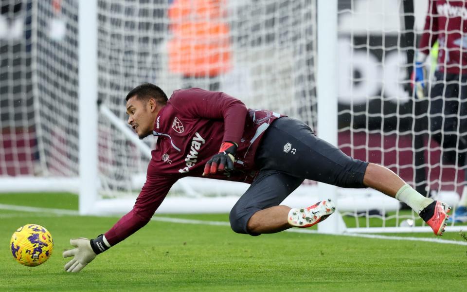 Alphonse Areola dives to make the save during a pre-match warm-up