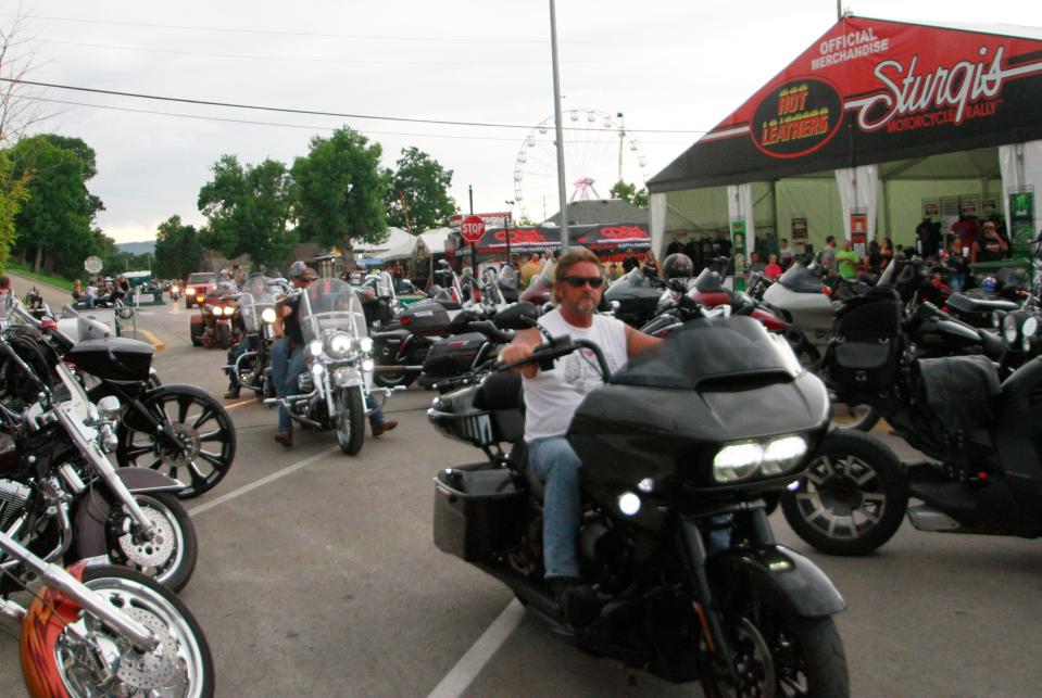 Bikers ride through downtown Sturgis, S.D., on Aug. 7, 2020. Organizers of the Sturgis Motorcycle Rally expected 250,000 people to visit the town of Sturgis during the 10-day rally.