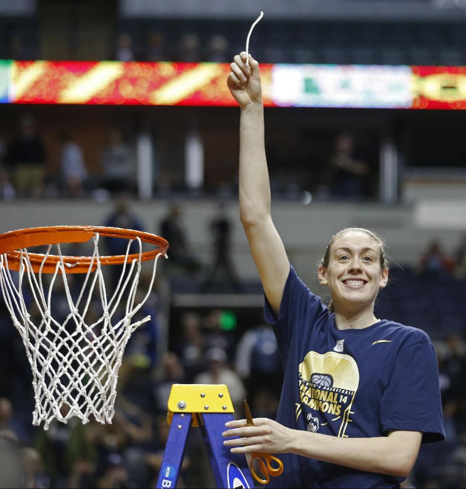 Connecticut forward Breanna Stewart holds the net after the second half of the championship game against Notre Dame in the Final Four of the NCAA women's college basketball tournament, Tuesday, April 8, 2014, in Nashville, Tenn. Connecticut won 79-58. (AP Photo/John Bazemore)