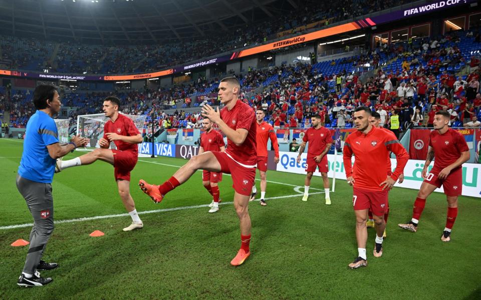 Serbia players during the warm up before the match - REUTERS