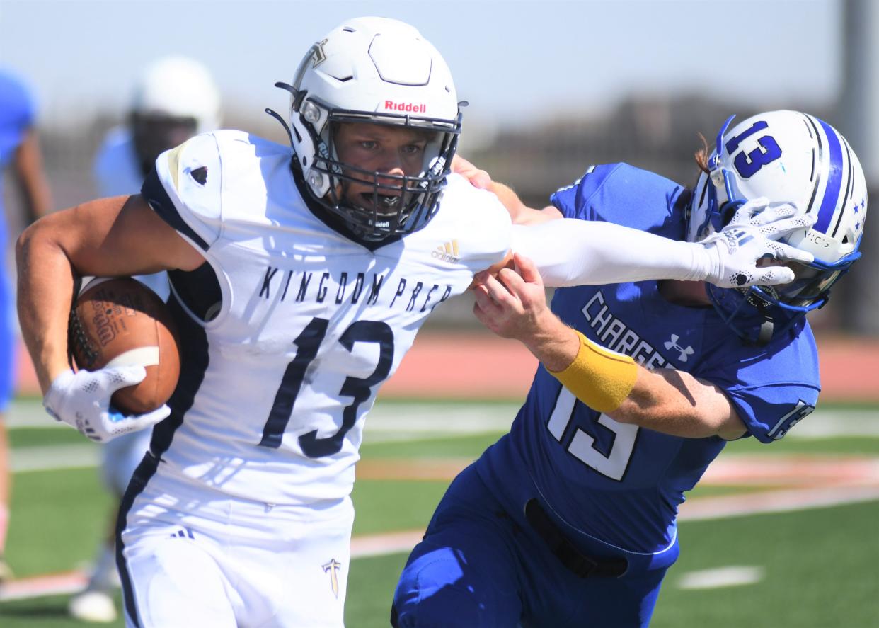 Kingdom Prep's Ben Lashaway, left, stiff-arms Midland Trinity's Hagan Renfro in a game Saturday, Oct. 9, 2021, at Archie Warwick Memorial Stadium in Lubbock.