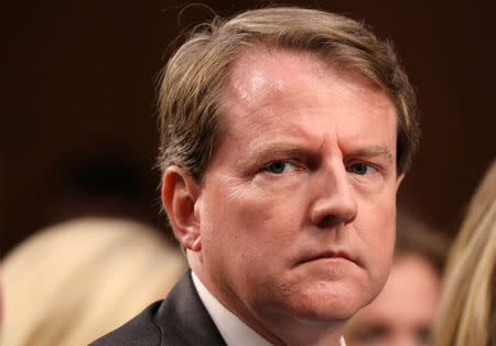 FILE PHOTO: White House Counsel Don McGahn listens during the confirmation hearing for U.S. Supreme Court nominee judge Brett Kavanaugh on Capitol Hill in Washington, U.S., September 4, 2018. REUTERS/Chris Wattie/File Photo