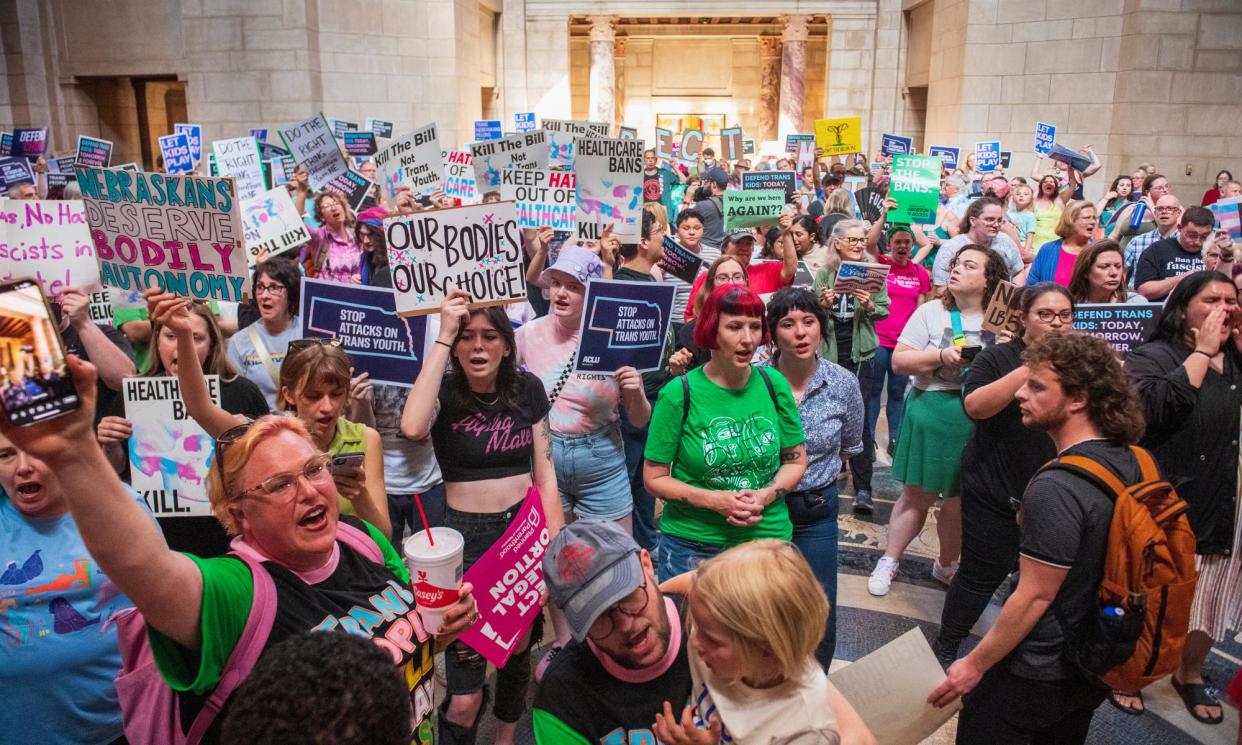 <span>Pro-abortion rights protesters fill the legislative chamber at the state capitol in Lincoln, Nebraska, in May 2023.</span><span>Photograph: Kenneth Ferriera/AP</span>