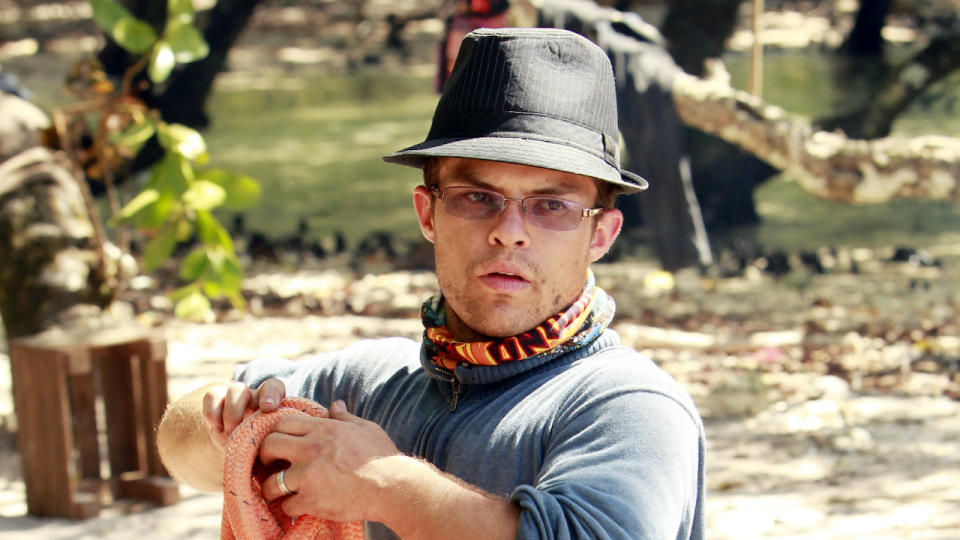 Leif Manson gathering rope on the beach.