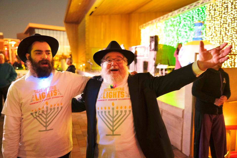 Mendel Levertov and Rabbi Ovadia Goldman, spiritual leader of Chabad Community Center for Jewish Life and Learning, celebrate the first night of Hanukkah during the 2021 "Scissortail Lights" event at Scissortail Park in downtown Oklahoma City.
(Photo: Provided by Scissortail Park)