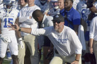 Indiana State NCAA college football head coach Curt Mallory signals to his offense during the Sycamores' overtime win against North Alabama on Sept. 1, 2022, in Terre Haute, Ind. Mallory, a former Michigan player who followed his father and brothers into coaching and has spent three decades in the profession, had never before been awoken by the dreaded pre-dawn knock on the door. On Aug. 21, he opened it to find athletic director Sherrard Clinkscales on the other side. (Joseph C. Garza/The Tribune-Star via AP)
