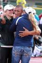 <p>Ashton Eaton celebrates with his girlfriend Brianne Theisen (L) and mother Roslyn Eaton (R) after breaking the world record in the men’s decathlon after competing in the 1500 meter run portion during Day Two of the 2012 U.S. Olympic Track & Field Team Trials at Hayward Field on June 23, 2012 in Eugene, Oregon. (Photo by Andy Lyons/Getty Images) </p>